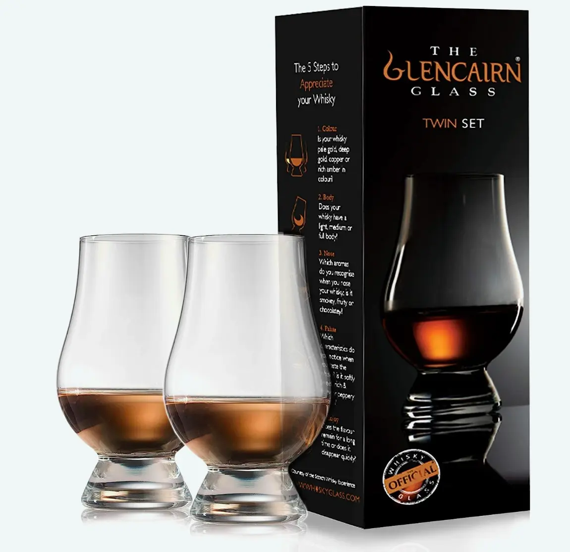 Two Glencairn whisky glasses next to their packaging box